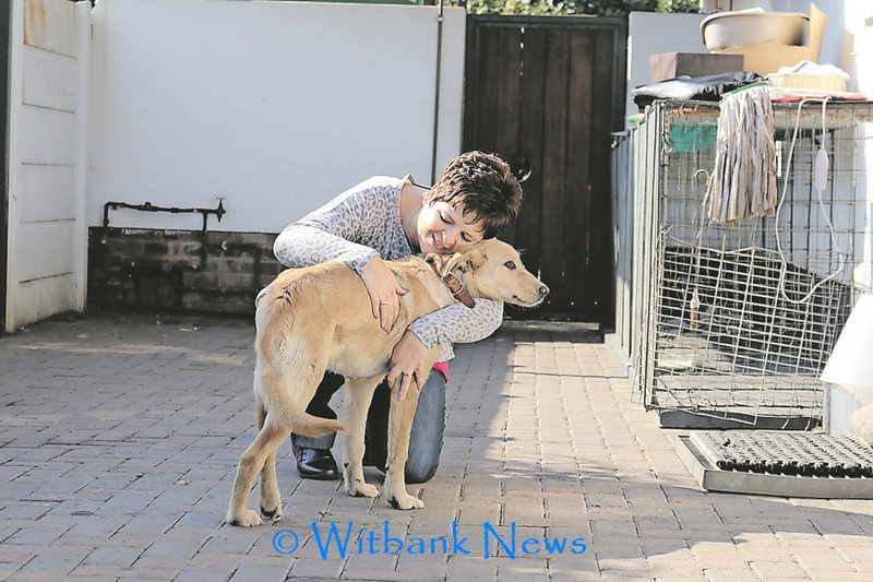 Ms Ester Muller hugs her new family member.