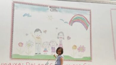 Niralya Padayachy in front of her winning sketch on a delivery truck. (Photo supplied)
