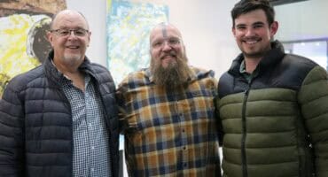 Dolf and Adolf van Wyk with Riaan Swiegelaar in the middle at NLC men’s breakfast in June 2025.