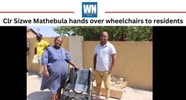 Clr Sizwe Mathebula handing over three wheelchairs to residents in Lynnville.