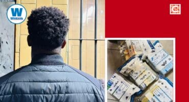 A foreign national was arrested for possession of illicit cigarettes and bribery of a police official.