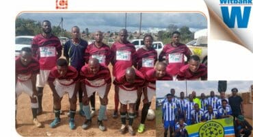 Witbank football teams preparing for match on a sunny day.