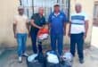 Thabiso Mogoba, Tefo Maraba, Phillip Rapakgadi Phatudi and Fani Ndlovu with some of the donated clothes.
