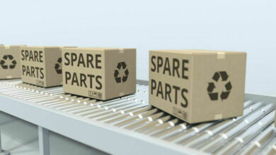 Cartons with spare parts on roller conveyor. 3D rendering