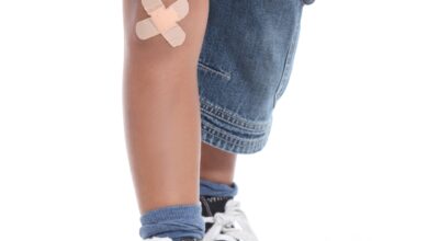 Closeup of a plaster on a little boy's knee