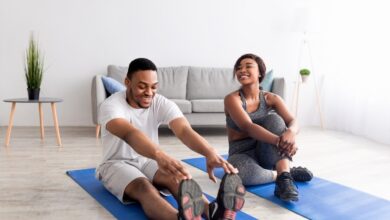 Fit,Black,Couple,Exercising,On,Yoga,Mats,At,Home,,Full