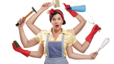 pretty very busy multitasking housewife on white