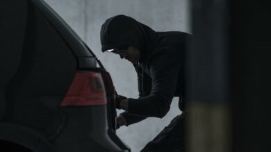 side-view-of-burglar-jacking-car-in-basement-royalty-free-image-1574291612