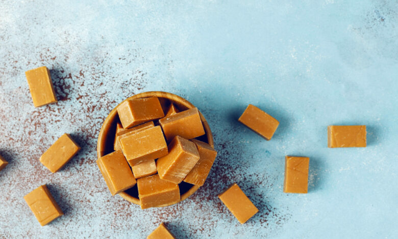 Tasty salty caramel fudge candies with sea salt,top view