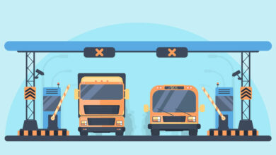 Toll higway. Toll gate construction. Arch for automatic charging on a toll road. Bus and lorry truck on roadway.