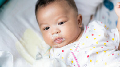 Why does my baby vomit after breastfeeding?
