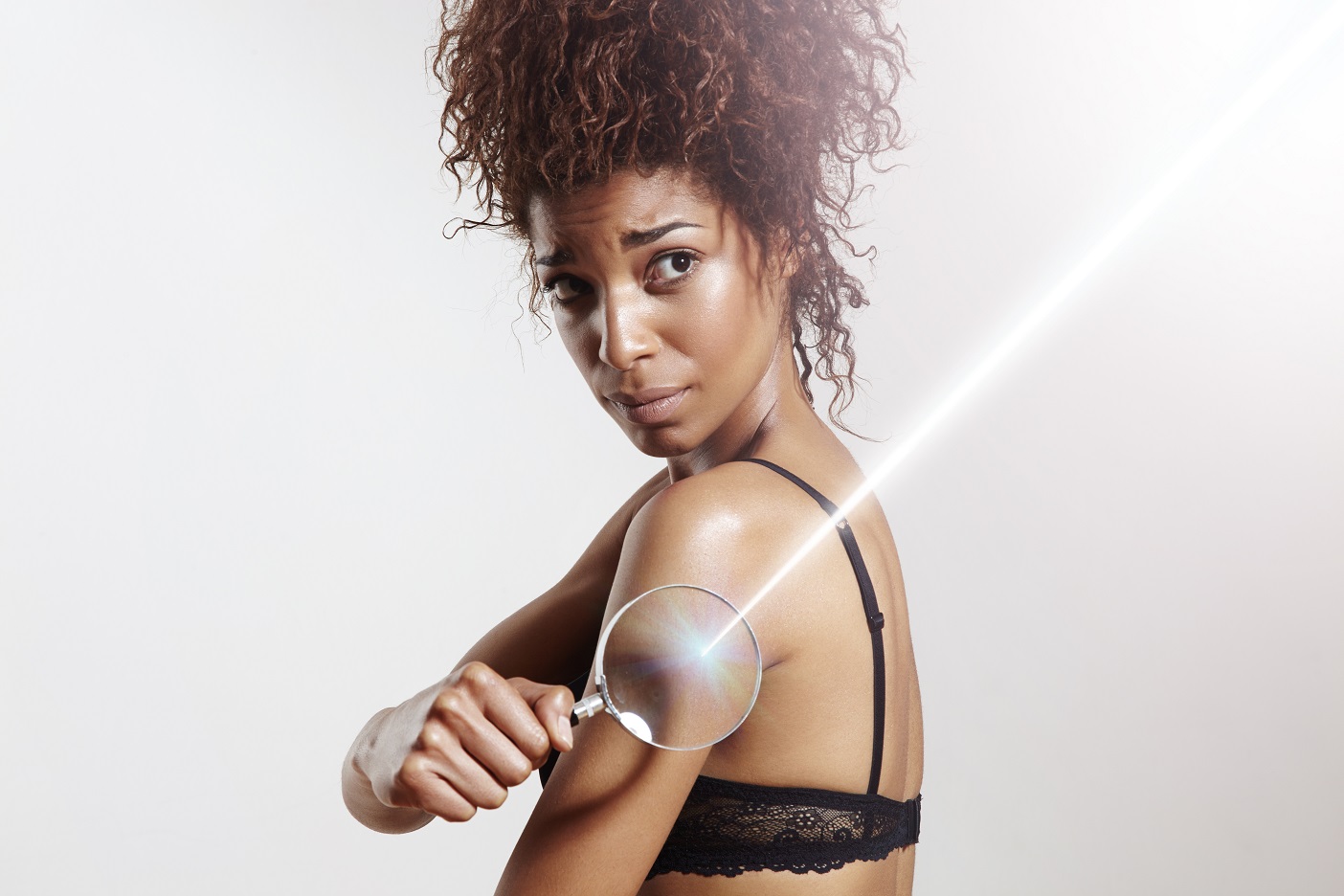 Woman,With,Lens,And,Ray,Of,Laser.,Spf,Concept,,Sun