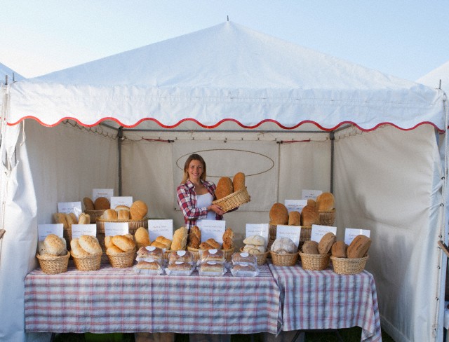 Female Baker On Stall At Country Fair