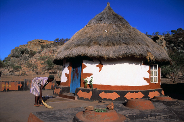 Woman Sweeping Ground