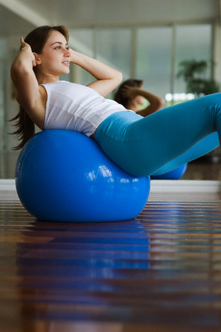 Young Woman Doing Sit-ups