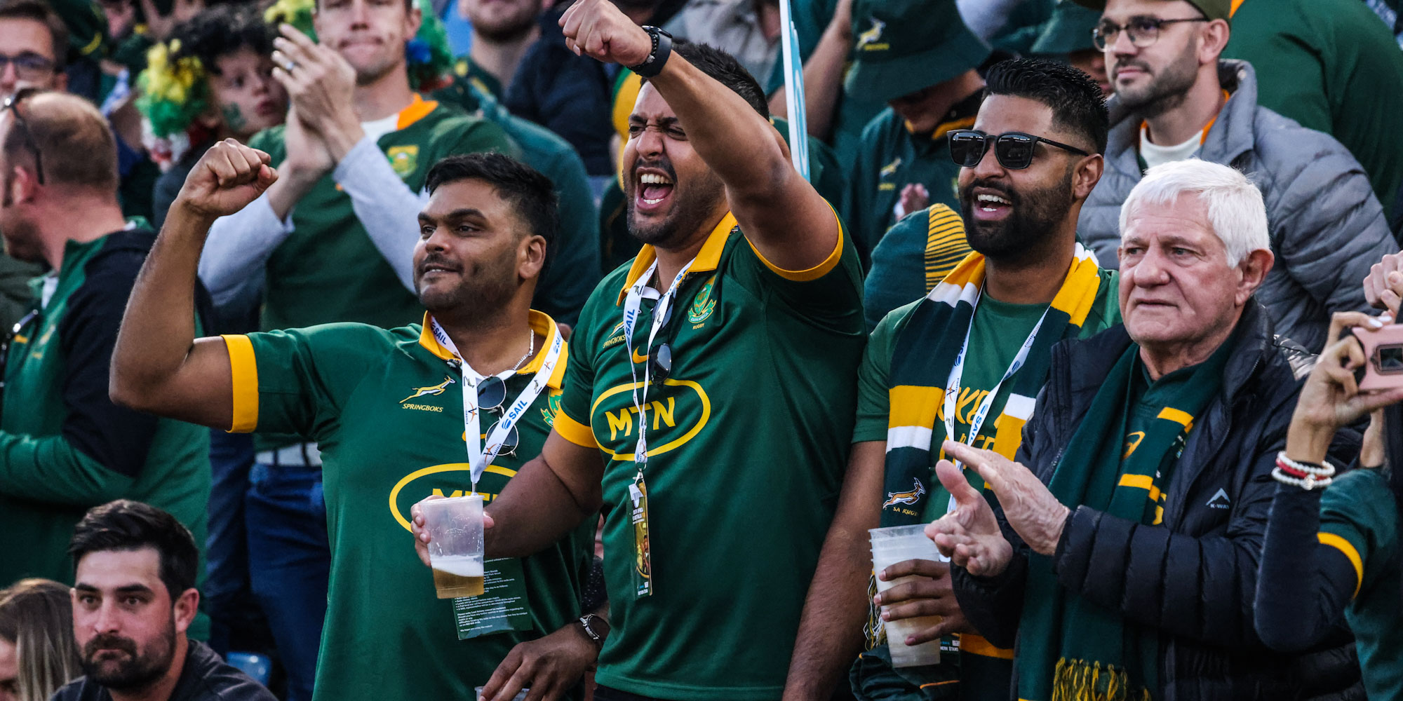 Springbok rugby fans celebrate from the stands.