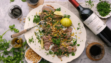 Rare roast lamb served with a glass of Sauvignon