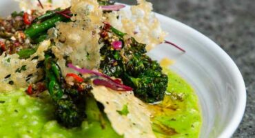 Green risotto with herb oil and charred Tenderstem broccoli