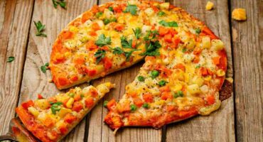 Grilled pizza on the braai with mixed vegetables