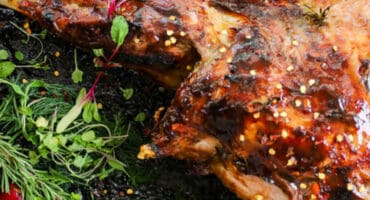 Roast lamb rubbed with jalapeño sauce for a spicy kick