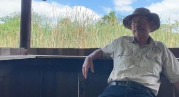 Man sitting in a bird hide