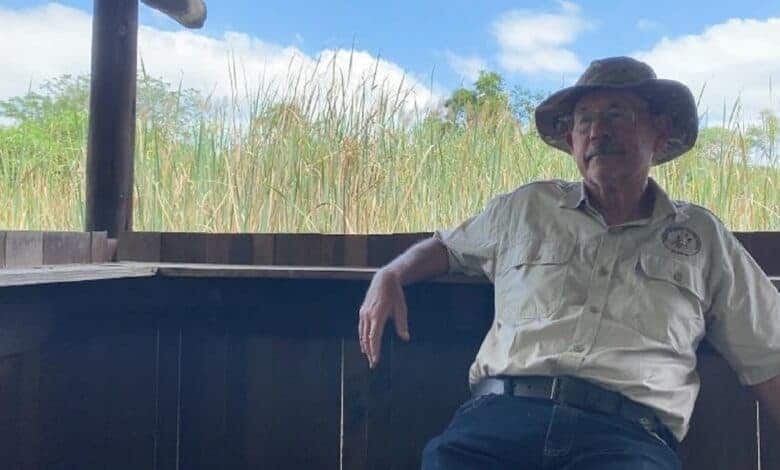 Man sitting in a bird hide