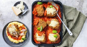 Parmesan-crusted chicken thighs in a homemade tomato sauce