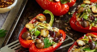 Baby button stuffed red peppers with wild rice and toasted pecans