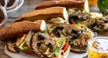 Melted mozzarella and mushroom loaded baguette