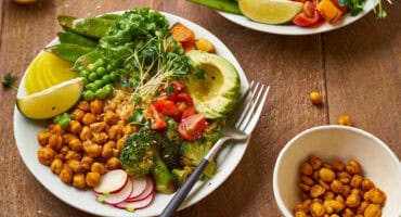 Veggie bowl with avocado, roasted chickpeas and crunchy greens