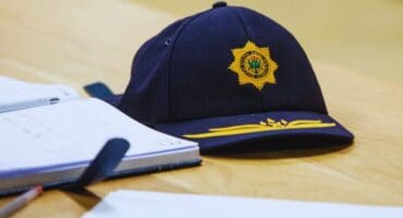 blue police cap on a desk