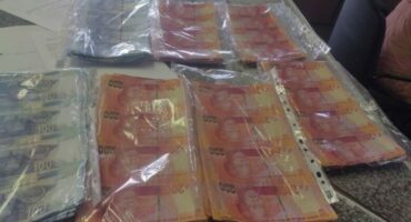 counterfeit money in plastic bags
