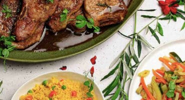 Glazed pork chops with stir fry veggies and rice