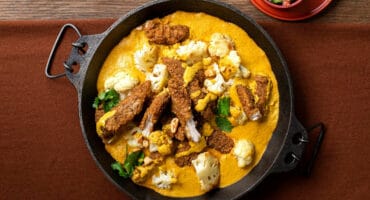 Cauliflower and chicken strip korma served with basmati rice