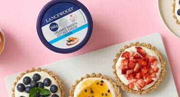 Healthy mini breakfast cheesecakes topped with fresh fruit