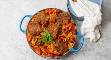 One pot spiced tomato, pepper, chorizo and chicken thigh paella