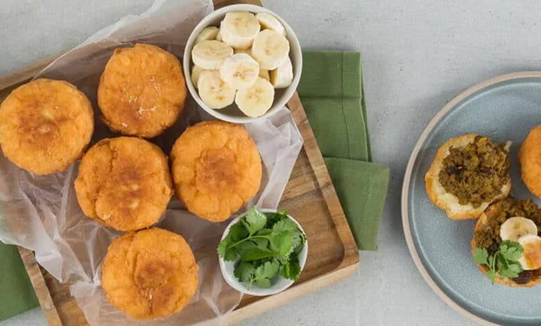 Vetkoek with spicy chakalaka and cheddar cheese