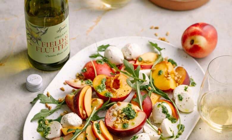 Stone fruit Caprese salad with bocconcini and basil pesto drizzle 