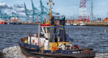 boat in durban harbor with cargo ships in background