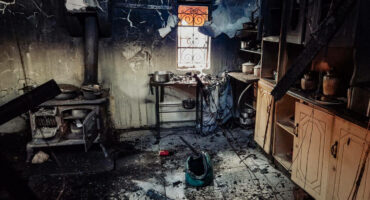 The Vilakazi family outside their home, which was destroyed by the fire.