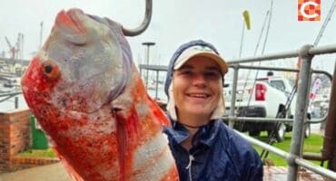 Owen Lineker poses proudly with his double-record catch.