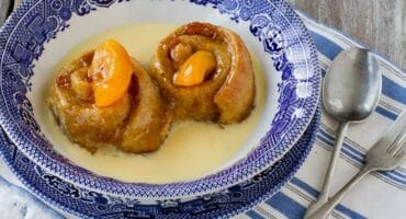 Apricot roly-poly baked pudding with custard