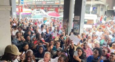 Hundreds of people gathered in the Durban CBD yesterday to demand justice for the Dlamini twins, who fell down a lift shaft a week ago.
