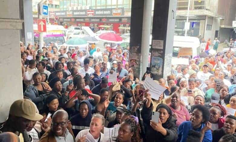 Hundreds of people gathered in the Durban CBD yesterday to demand justice for the Dlamini twins, who fell down a lift shaft a week ago.
