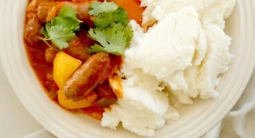 Pap and sausage bredie with chilli and fresh coriander