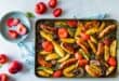 Sticky spiced sausage and plum traybake recipe