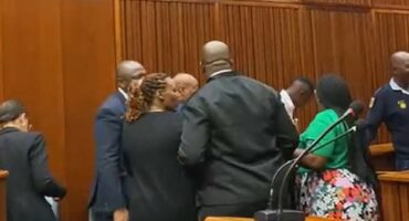 An emotional Theo Makgatho is escorted out of the courtroom by loved ones and his mother’s legal team.
