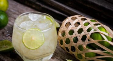 Classic caipirinha blends muddled lime, sugar and cachaça