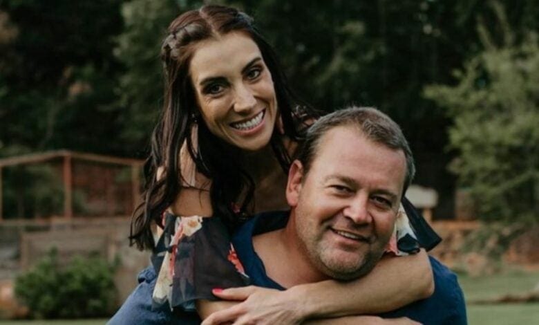 Happy couple smiling at the camera.