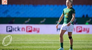 Rugby player Nadine Roos on the rugby field.